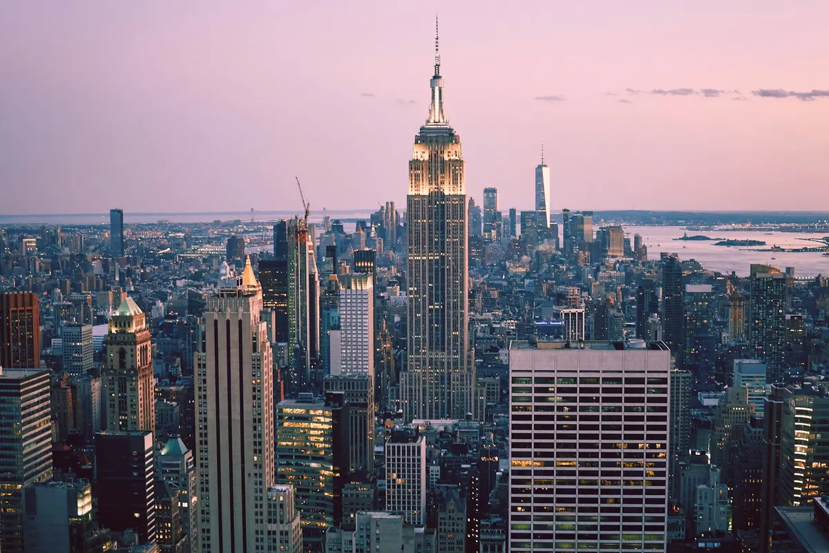 Midtown Manhattan towers lit at twilight